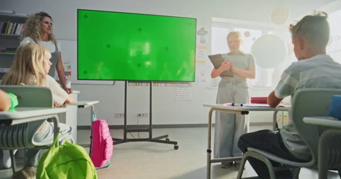 Primary School Girl with Tablet Computer Showcasing Knowledge. Digital Screen Stock Footage 315536818