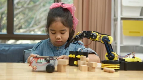 Primary School Girl Using App to Control Car in STEM Class Stock Footage 270478343