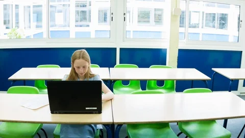 Primary school girl working on computer after class Video stock 104239589