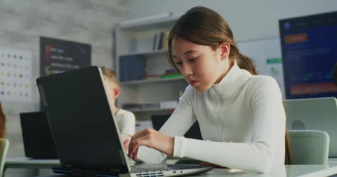 Primary School Girl Working on Creative Project on Laptop, Practicing Digital Stock Footage 315471327