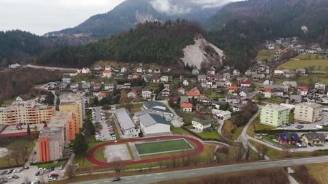 Primary School in Mountain Landscape of Tržič, Slovenia. Aerial Stock Footage 334030107