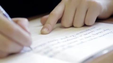 Primary school student writting  in the notebook Video stock 62859614