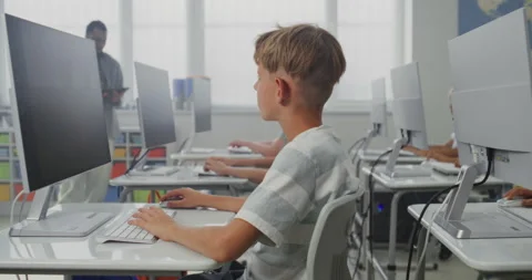 Primary School Students Drawing Pictures on Computers, Working on Creative Stock Footage 316302776