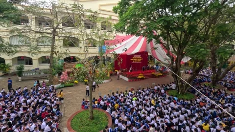 Primary school students line up ceremony in a schoolyard. Can Tho, Vietnam Stock Footage 243418007