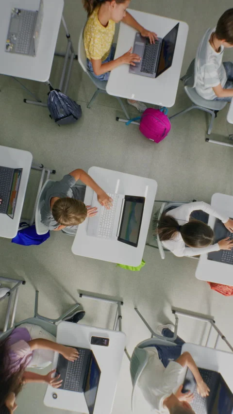 Primary School Students Practicing Digital Skills on Laptops, Creating Pictures Stock Footage 315470709