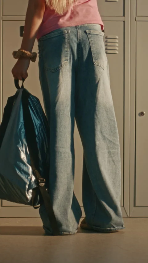 Primary School Students Using Lockers in Sunny Hallway Before Classes Stock Footage 342035837