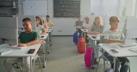 Primary School Students Working on Creative Projects on Computers Stock Footage 316301115