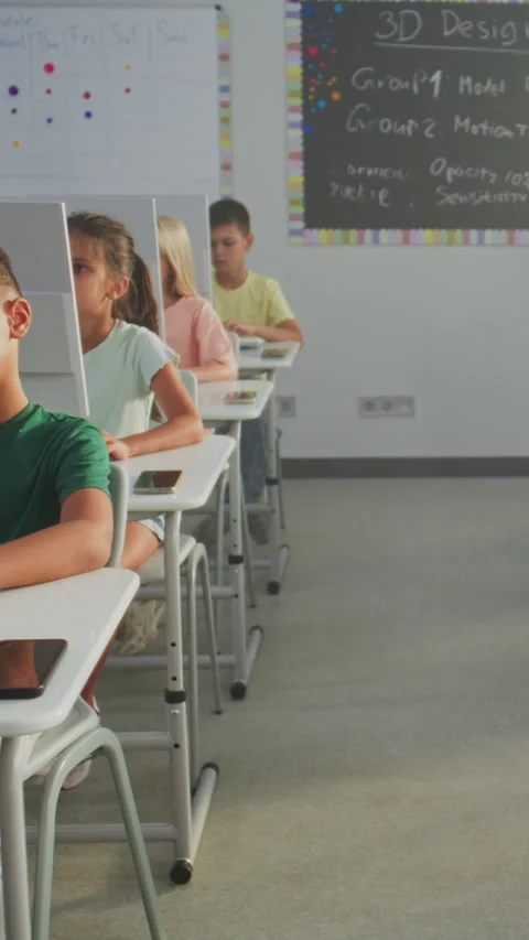 Primary School Students Working on Creative Projects on Computers Stock Footage 317168893