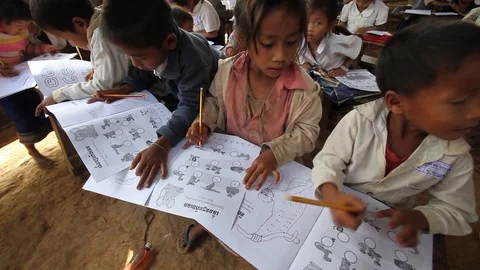 Primary schoolchildren with exercise book in primitive classroom Video stock 121094691