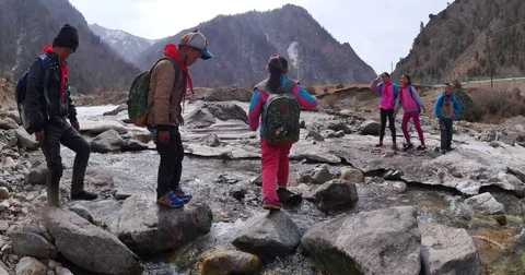 The primary  student go to school  cross the cold river Video stock 77927149