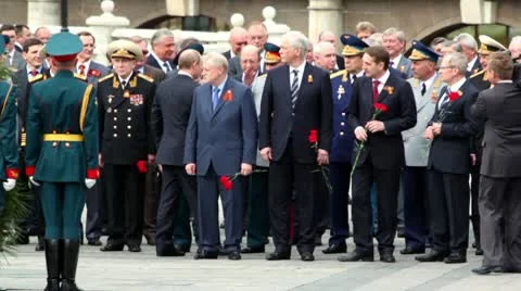 Prime minister of Russia V.Putin walk and greets political leaders and military Stock Footage