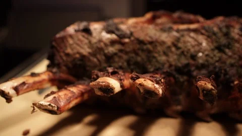 Prime ribs still together with bones sticking out slow motioin 스톡 동영상 112140390