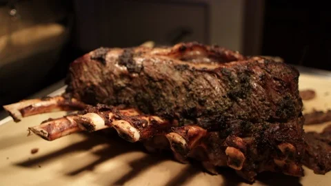 Prime ribs still together with bones sticking out move left Video stock 112140414