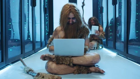 Primeval IT engineer using laptop computer discovering technology at modern Stock Footage 121123140