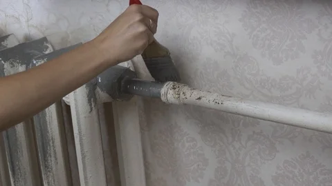Priming heating batteries before painting Stock Footage 116129705