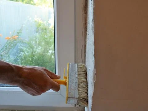 Priming the slope of the room window Stock Photos