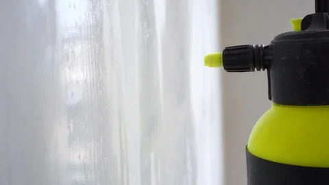 Priming the wall surface with an atomizer close-up in slow motion Stock Footage 106410819