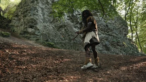 Primitive caveman of african ethnicity dancing a fun futuristic dance walking Stock Footage 116635624
