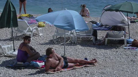 Primosten sunbathing on the beach Stock Footage 45828309