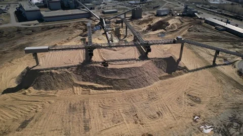 Prince George Canfor Pulp Mill chip pile and bulldozer working on the chip pile Stock Footage 251599800