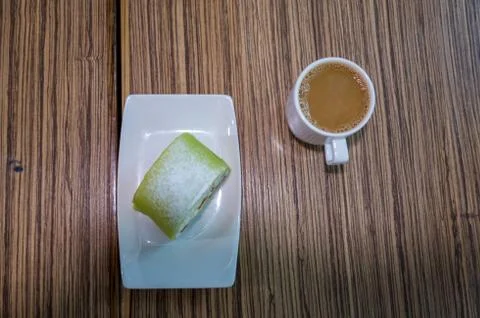 Princess cake with coffee on a table at the cafe on board a cruise ship Foto stock