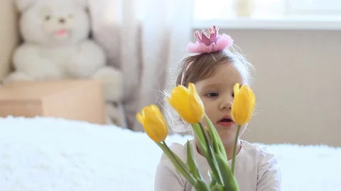 Princess girl with yellow tulips Stock Footage 73690553