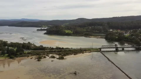 Princess highway bridge over Wagonga inlet in Narooma town – aerial 4k. Stock Footage 194480273