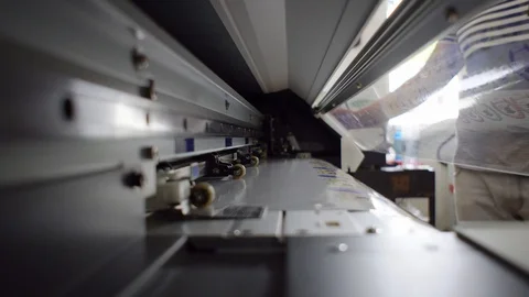Print and cut machine, interior shot while cutting stickers and labels Stock Footage 101261492