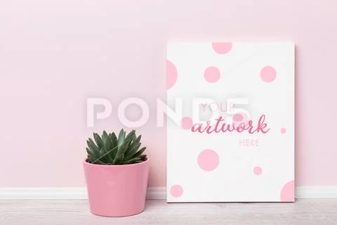 Print on canvas  mockup template with succulent in pink flower pot in front o PSD Template