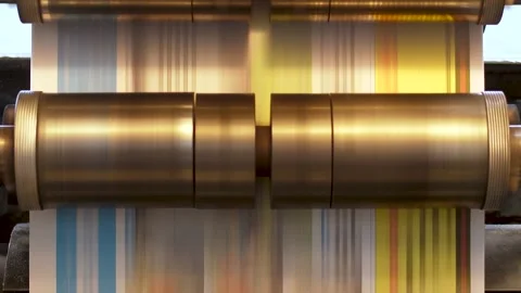 A print machine working fast with rollers and paper moving through the Stock Footage 155786255