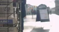 Print media headlines covering latest world news, active urban life background HD Footage