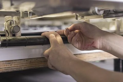 Print Operator Working printing operator working on an offset printing mas... Stock Photos