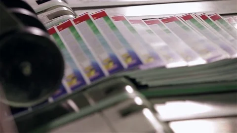 Print plant factory, magazine transports on conveyor belt line after printing un Stock Footage