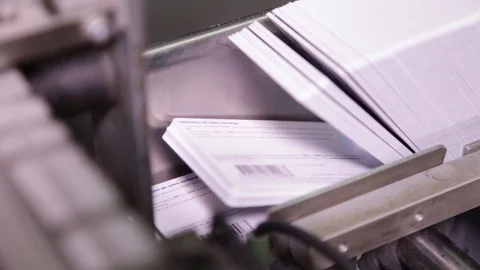 Printed cards on conveyor Stock-Footage 85786831