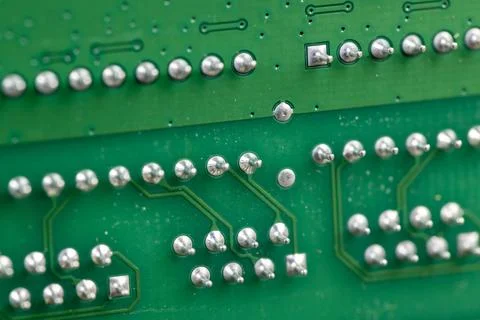 A printed circuit board with an electronic circuit with soldered elements Stock Photos