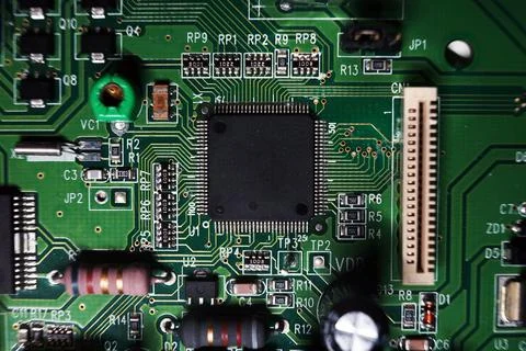 Printed Circuit Board with many electrical components. Selected focus. 스톡 사진