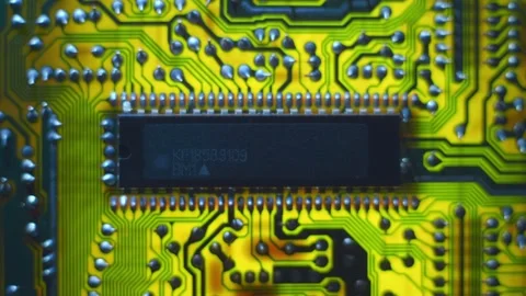 A printed circuit board with microchip whitch cast shadows that follow the light Stock Footage 268894521