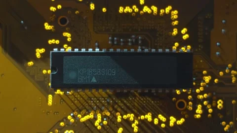 A printed circuit board with microchip whitch cast shadows that follow the light Stock Footage 268895107