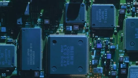A printed circuit board with microchips, capacitors and other radio components Stock Footage 268895399