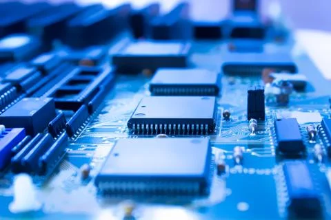 Printed circuit board with microprocessor in blue Stock Photos