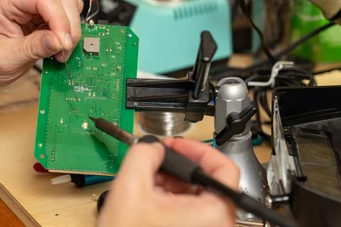 Printed circuit board in vice on workbench Stock Photos