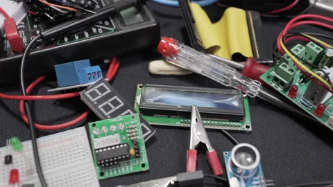 Printed circuit boards, microcircuits and engineering equipment on the table Stock Footage 136696070