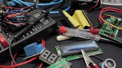 Printed circuit boards, microcircuits and engineering equipment on the table Stock Footage 136696332