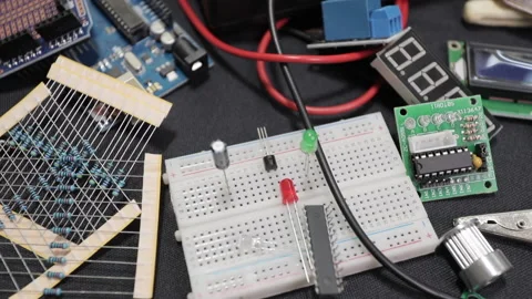 Printed circuit boards, microcircuits and engineering equipment on the table Stock Footage 136696488