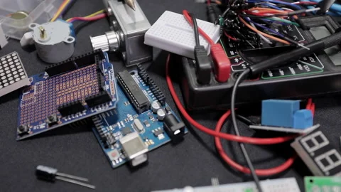 Printed circuit boards, microcircuits and engineering equipment on the table Stock Footage 136696950