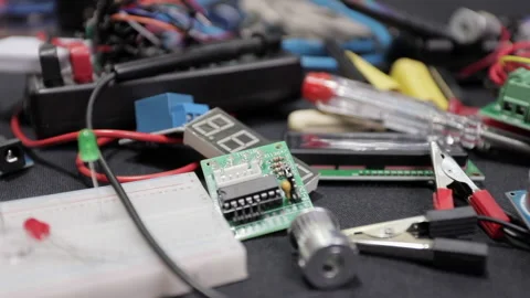 Printed circuit boards, microcircuits and engineering equipment on the table Stock Footage 136697352