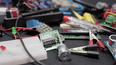 Printed circuit boards, microcircuits and engineering equipment on the table Stock Footage 136697519
