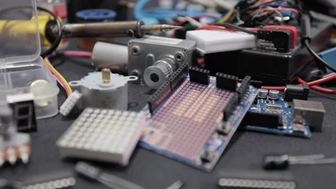 Printed circuit boards, microcircuits and engineering equipment on the table Stock Footage 136697595
