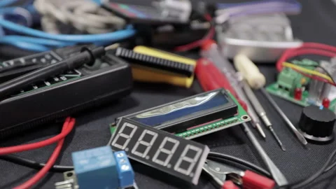 Printed circuit boards, microcircuits and engineering equipment on the table Stock Footage 136698003