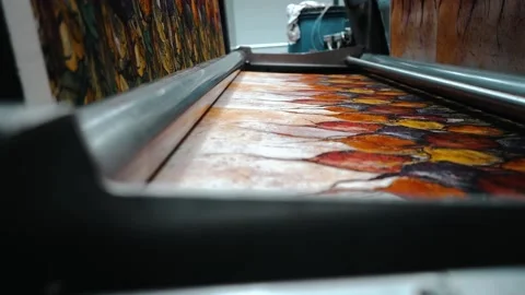 Printed design leaving one machine and entering another Stock Footage 135269704